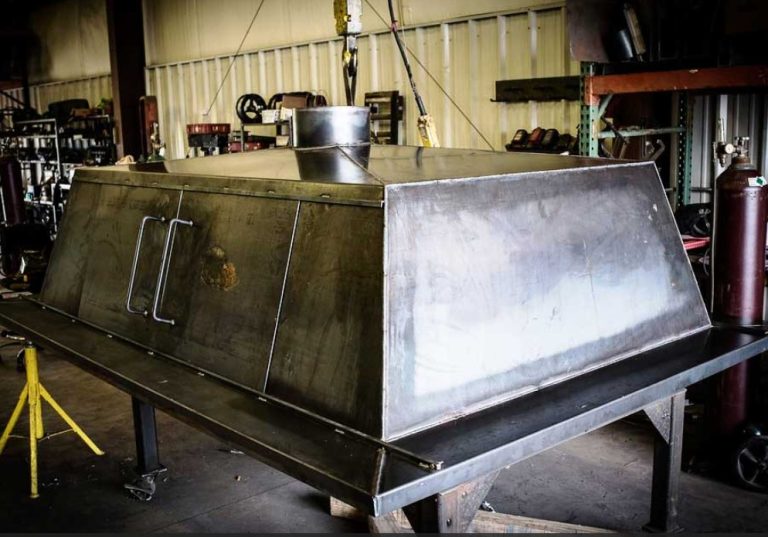 A custom fabricated steel hood assembly. custom parts manufacturing